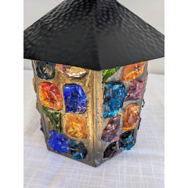 Authentic vintage Peter Marsh wall-mounted lantern, featuring hand-set multicolor chunk glass in a hammered metal frame....