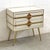 Cabinet with two drawers, wooden structure covered with white glass and details on brick-coloured glass handles,...