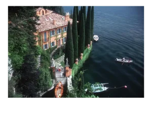 1983 "Giacomo and Stefania Montegazza Welcome Guests Arriving by Boat at their Villa, La Cassinella, on Lake Como" Slim Aarons C-Print