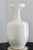 A striking tall white studio pottery vase featuring a sculptural flared collar and clean modern silhouette, perfect for...