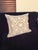 This elegant Restoration Hardware decorative pillow features a soft gray linen base with intricate white embroidered...