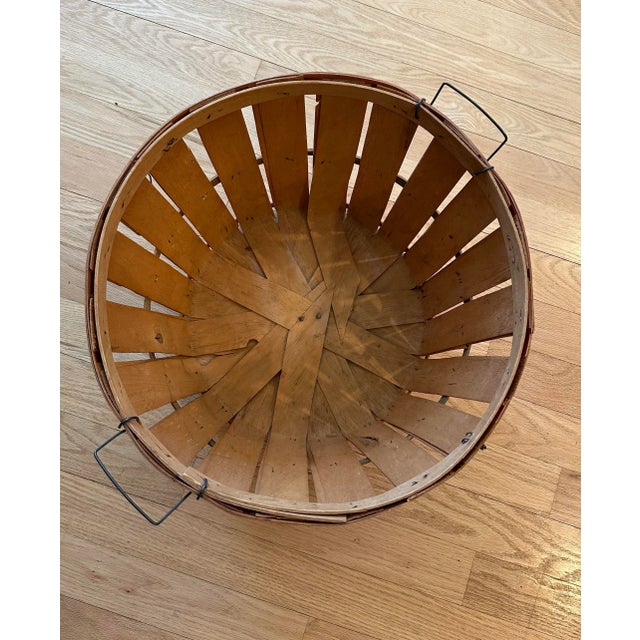 Vintage wood bushel basket with a touch of red stain and metal handles. Functional storage -blankets, knitting, toys, or...