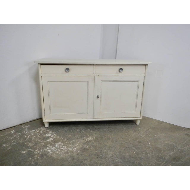 Made of white and natural varnished fir wood, with two drawers (64x37x9 cm) and two doors. Inside is a natural fir shelf...