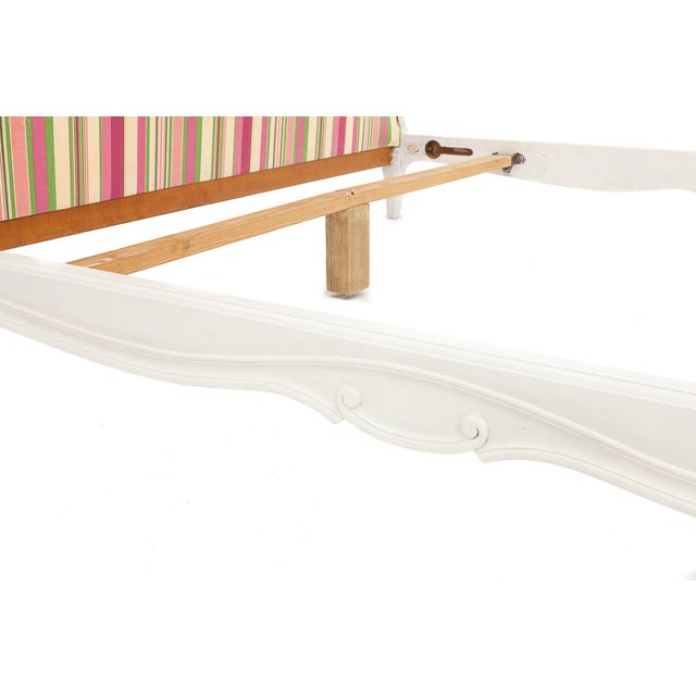 Vintage striped fabric single bed. Carved wooden frame with floral motifs. For a 140 x 190 cm mattress. Circa 1940.