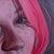 This oil on wood panel artwork presents a close-up view of a face, capturing an expressive gaze that resonates with an...