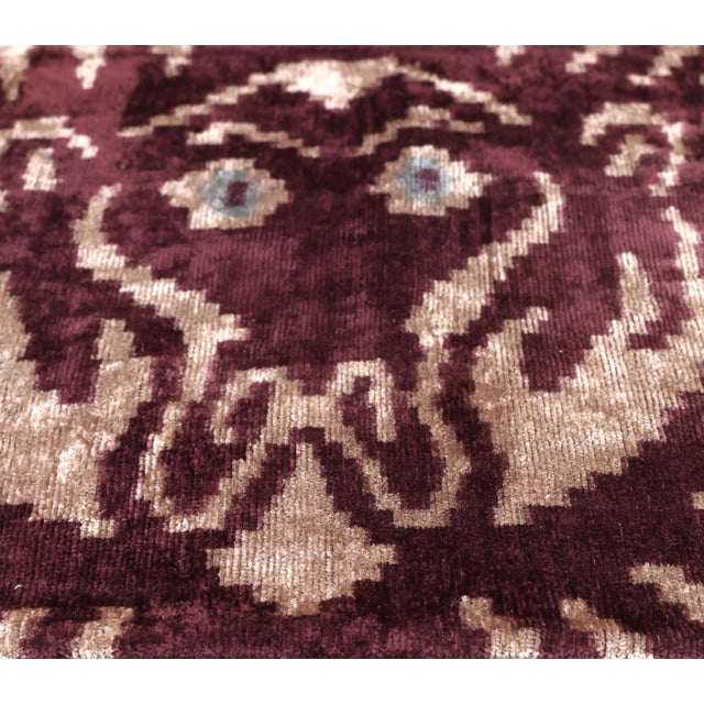 "Introduce a sense of regal heritage to your space with this exquisite hand-knotted silk velvet ikat lumbar pillow....
