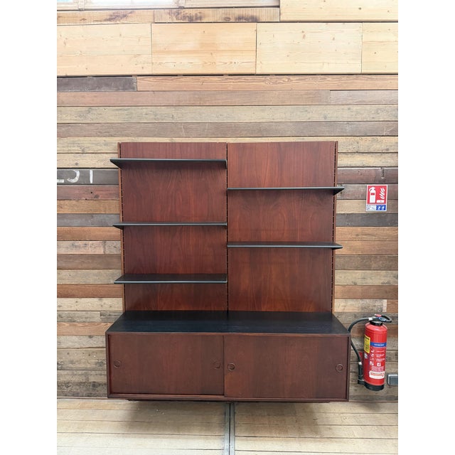 This large Scandinavian shelving unit has been fully restored. It features five removable and adjustable shelves, along...