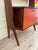 Single-span bookcase with shelves and cabinet with drop-leaf door, 1960s. The design of this teak bookcase recalls the...