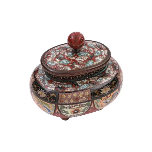 An antique Japanese copper covered jar or box with polychrome cloisonne enamel design. Late Meiji period,Squat rounded...