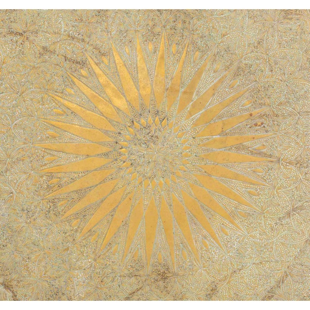 Indian Sunburst Motif Brass Circular Tray, with embossed starburst and floral motifs. 31.25" Diameter. Provenance: From a...