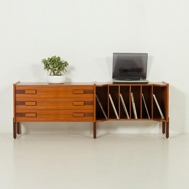 This Italian mid-century sideboard most likely comes from the 1970s, and it is a versatile and beautifully crafted piece,...