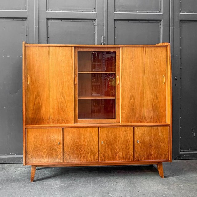 Product. Highboard style. Mid-century · 1960s manufacturer. Veb möbelindustrie halle (saale) material. Exterior veneered...