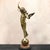 This elegant bronze balancing putti sculpture, created in the style of Auguste Moreau, presents a classical depiction of...