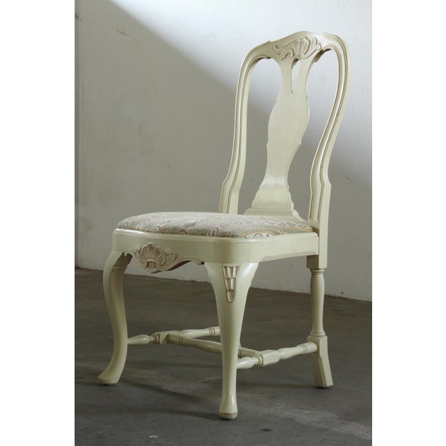 A set of four dining chairs that epitomize the romantic elegance of Swedish new Rococo design. Dating from the early...