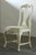 A set of four dining chairs that epitomize the romantic elegance of Swedish new Rococo design. Dating from the early...
