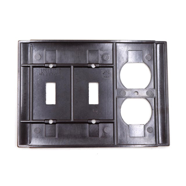 Vintage brown Bakelite ribbed wall switch plate with a duplex outlet and two gangs. Made by Arrow H&H. The original...
