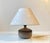 A beautiful mid-century stoneware table lamp with a stylish incised pattern around its perimeter. It was Handmade by Otto...