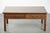 We are offering this charming antique English oak coffee table from the 20th century, featuring two drawers. Thanks in...