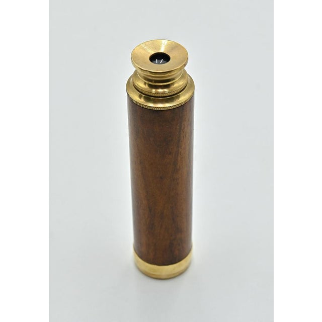 Vintage Telescope is a scientific object realized in the early 20th Century. A bronze telescope with glass lenses and...
