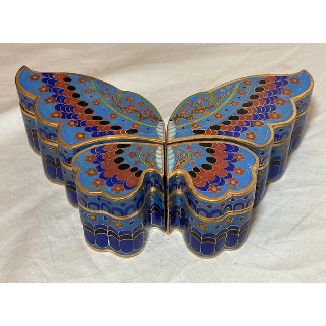 Experience the exquisite craftsmanship of Chinese artistry with this large vintage cloisonné enamel and brass butterfly...