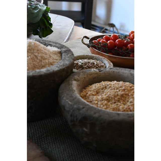 A hand-carved 20th century stone vessel with a beautifully weathered surface. Once used for grinding or preparing...