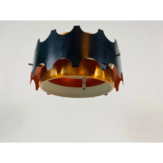 Black and copper pendant lamp made in Germany in the 1960s. The fixture gives a very beautiful light. It is made from thin...