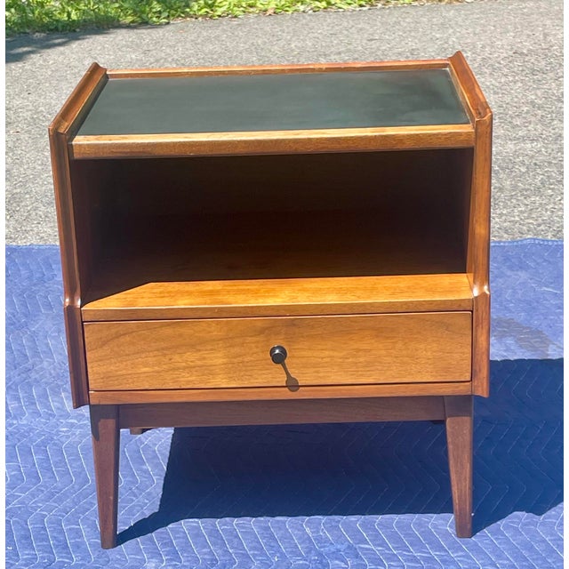 Elevate your bedroom aesthetic with this exceptional, authentic pair of mid-century modern walnut nightstands manufactured...