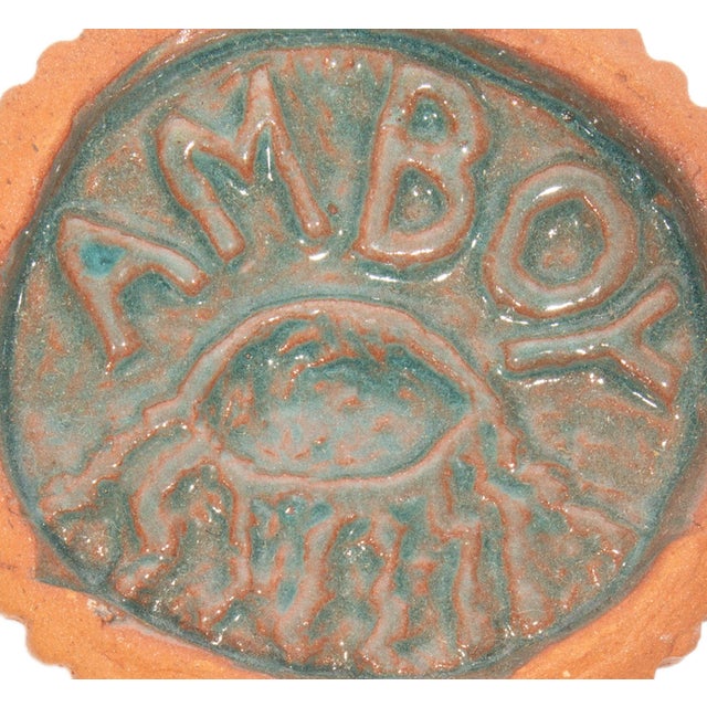 A studio pottery tile by the American artist Mark Bulwinkle (born 1946). This circular tile features the impressed image...