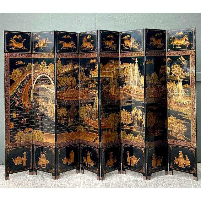 This monumental eight-panel Coromandel screen is a breathtaking example of traditional Chinese artistry and mid-century...