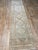 A stunning antique Malayer runner rug. This Malayer runner offers a beige and tan palette with brown and blue accents.