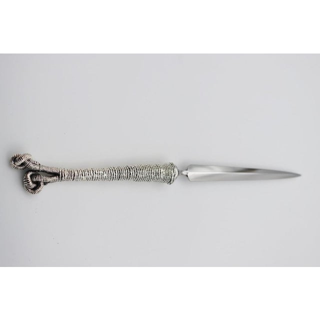 Letter opener in silver bronze. Silver plated bronze letter opener 35/42 microns Measures: L: 218 mm, weight: 118 gr This...