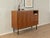 A wonderful highboard from the 1960s. High-quality walnut veneer cabinet with two cabinet doors, a drop-down compartment,...
