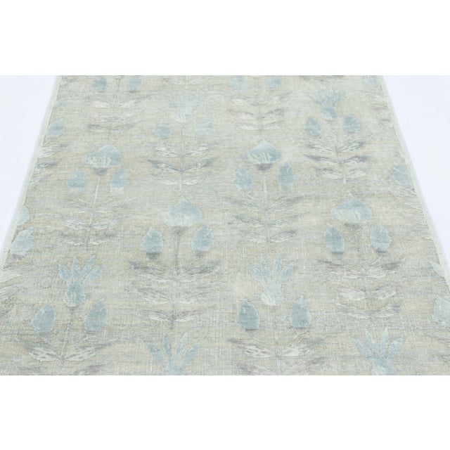 Hand-knotted in a luxurious blend of wool and silk, this 4x6 rug is a serene and sophisticated addition to the Rug &...