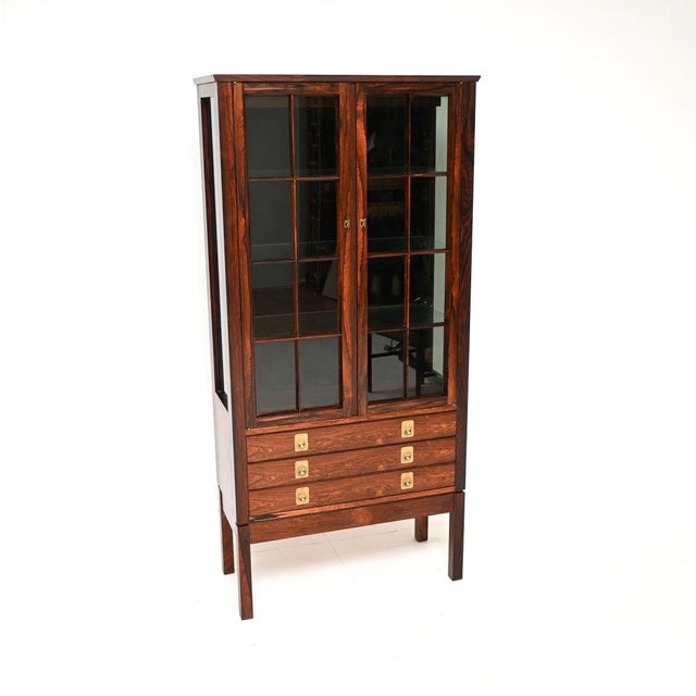 An absolutely gorgeous Scandinavian vintage display cabinet by Torbjorn Afdal. This was made in Norway by Bruksbo and it...