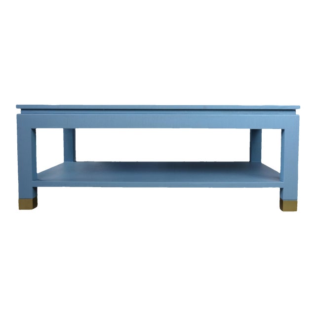 Karl Springer Style Modern Light Blue Linen-Raffia Coffee Table. With Four Brass Sabot For Sale