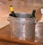 This antique French champagne cooler, crafted in pewter with a soft silvered finish circa 1920, was designed for both...