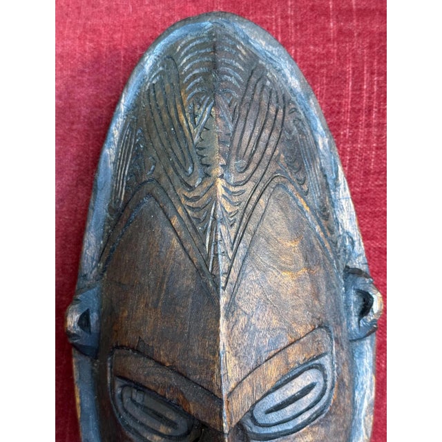 A rare and beautiful antique handcarved wooden mask from the Murik Lakes region of the Lower Sepik River in New Guinea. I...
