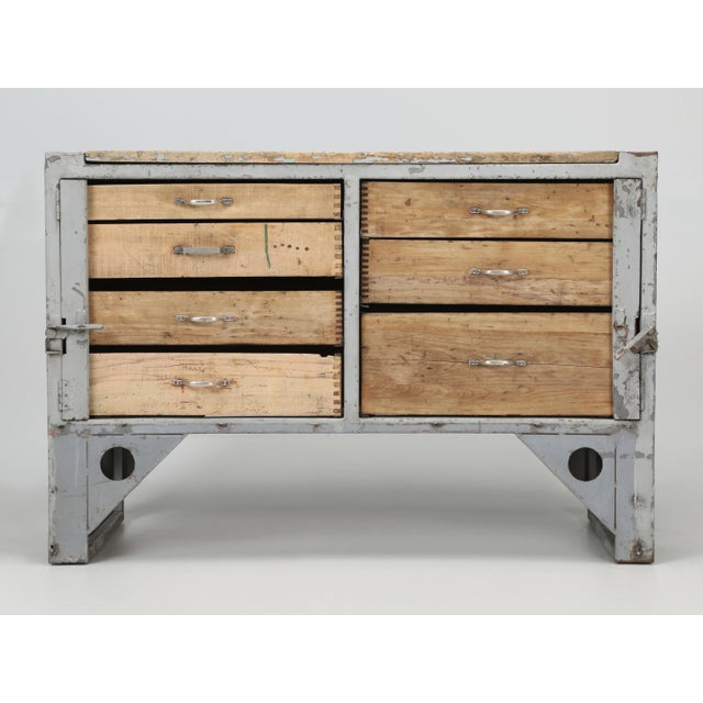 Industrial steel cabinet with (7) functional wood drawers in original paint. Would make a great additional kitchen work...