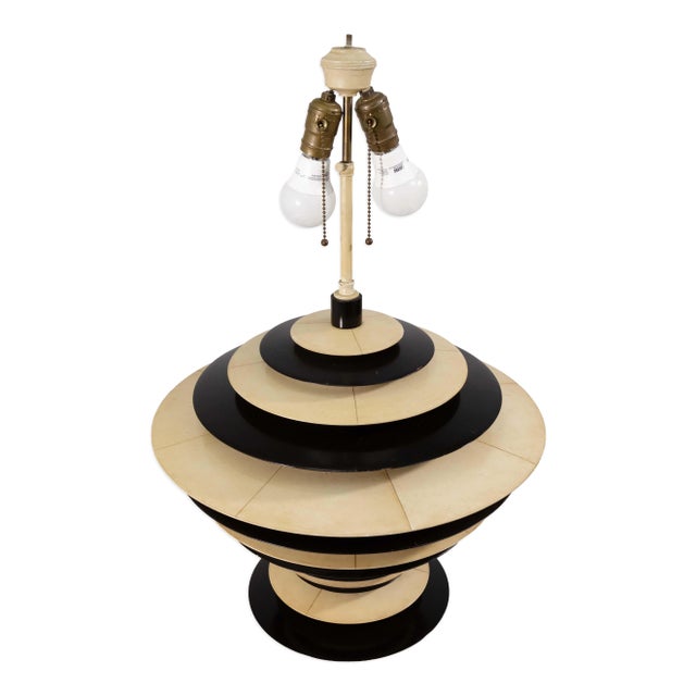 Striking and sculptural, this pair of large Art Deco-style lamps features a bold stacked discus design in contrasting...