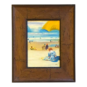 "Young Woman Reading a Book at the Beach"