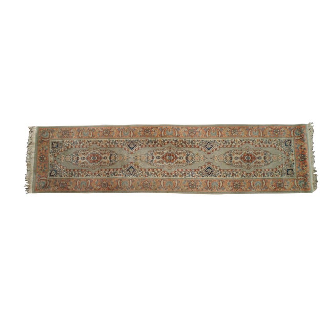 Traditional, hand-knotted runner rug. The runner boasts an elegant composition, highlighted by a sequence of three large,...