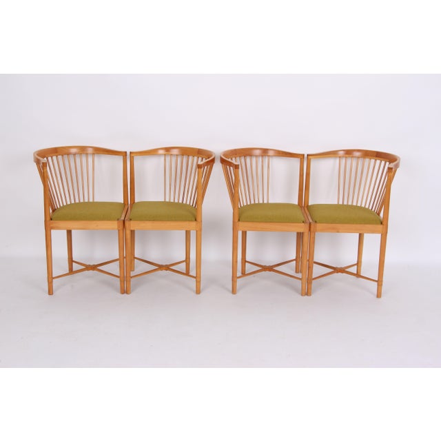 Four chairs, model "Ruder Konge." Designed by Børge Mogensen. Made of cherry wood and reupholstered in new, solid fabric....