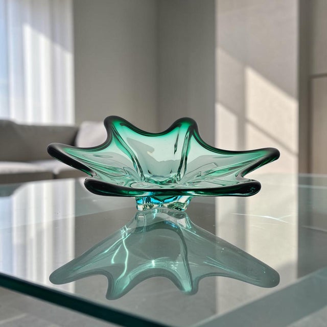 This hand-blown sommerso art glass bowl was probably produced in Murano, Venice, Italy during the Mid 20th Century, circa...