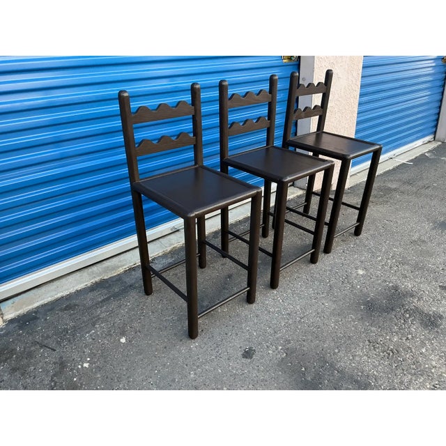 Set of 3mcountry French solid oak counter stools. Stools are done in a rich ebony finish. The stools were custom made. The...