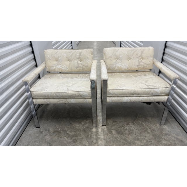 This pair of mid-century modern lounge chairs embodies the clean, architectural lines and relaxed proportions associated...