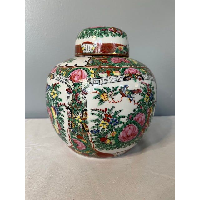 This Chinese Famille Rose ginger jar exemplifies the elegance and decorative richness of traditional Asian ceramics....