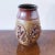 Mid-Century Hand Thrown Ceramic Pottery Vase in Stunning Brutalist Relief Design in Brown and Ochre Glaze, signed SM...