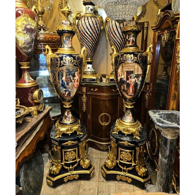 Make a dramatic statement with this breathtaking monumental Sevres-style porcelain vase on pedestal, a luxurious piece...