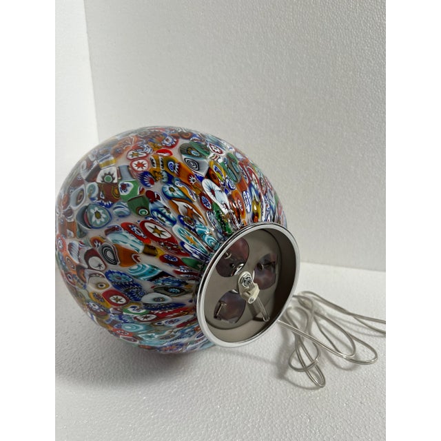 INCREDIBLE MURANO TABLE LAMP This stunning table lamp, in pure 1980s style, is a masterpiece of Venetian craftsmanship,...
