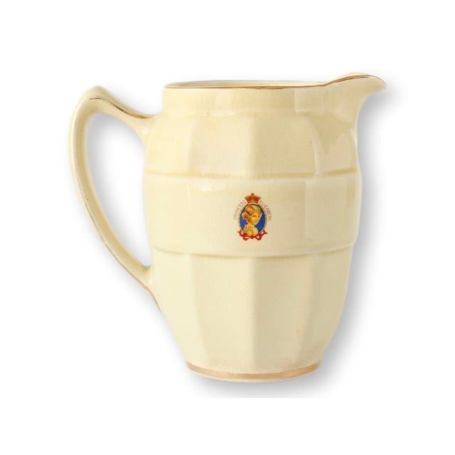 Charming English coronation jug commemorating King George VI and Queen Elizabeth, dated 1937. The front features finely...
